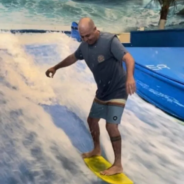 Riding a board on a wave machine