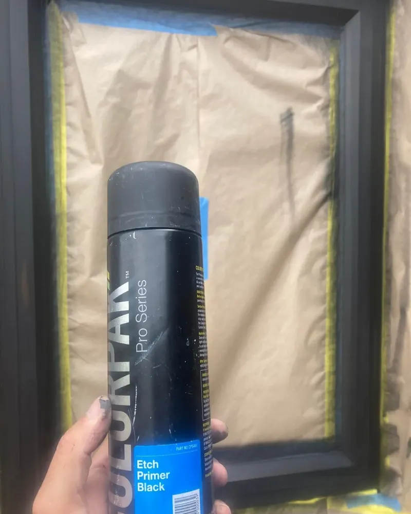 Aluminium window frame masked off and sprayed with black etch primer